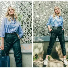 Elegancka stylizacja na rozmowę o pracę latem: błękitna koszula, grafitowe spodnie w kratę, białe sneakersy. Idealny dress code latem co ubrać na rozmowę o pracę w upalne dni.